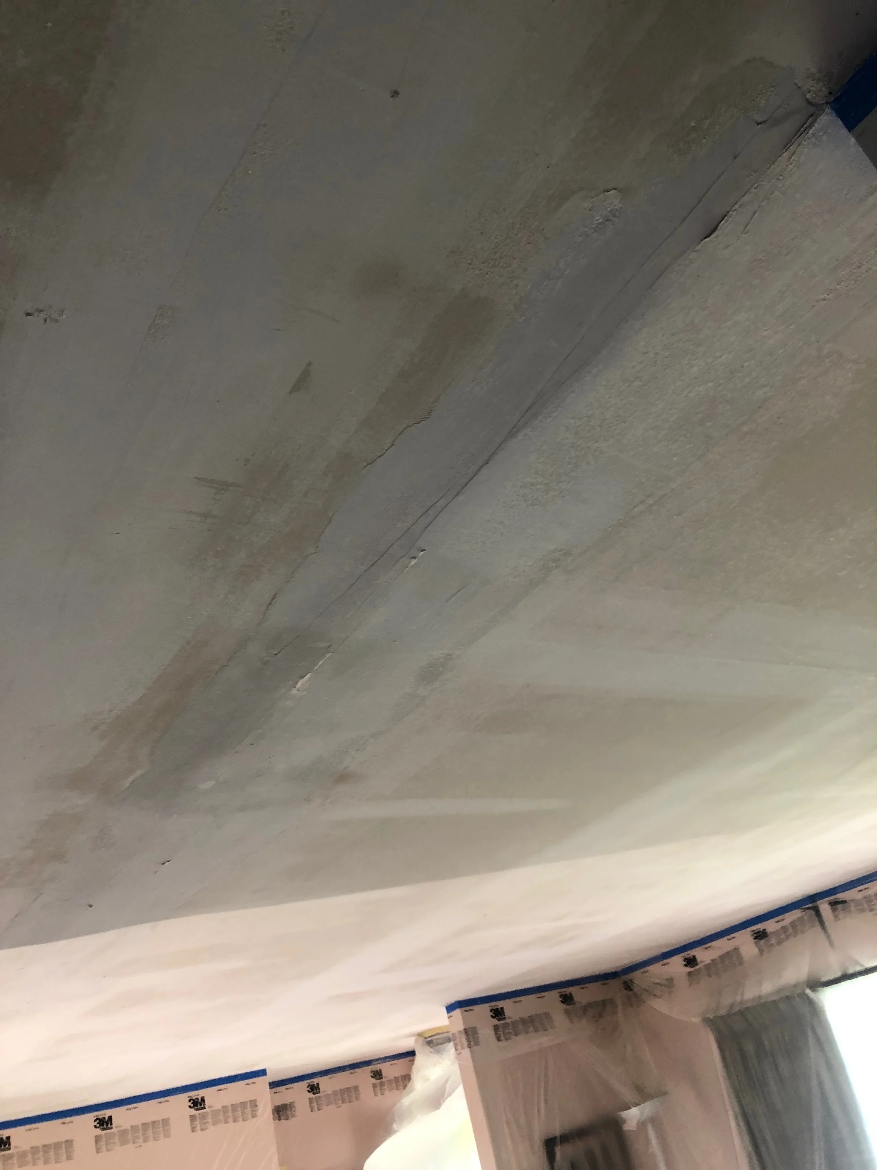 Drywall ceiling with joint compound finishing, taping, and surface preparation for painting
