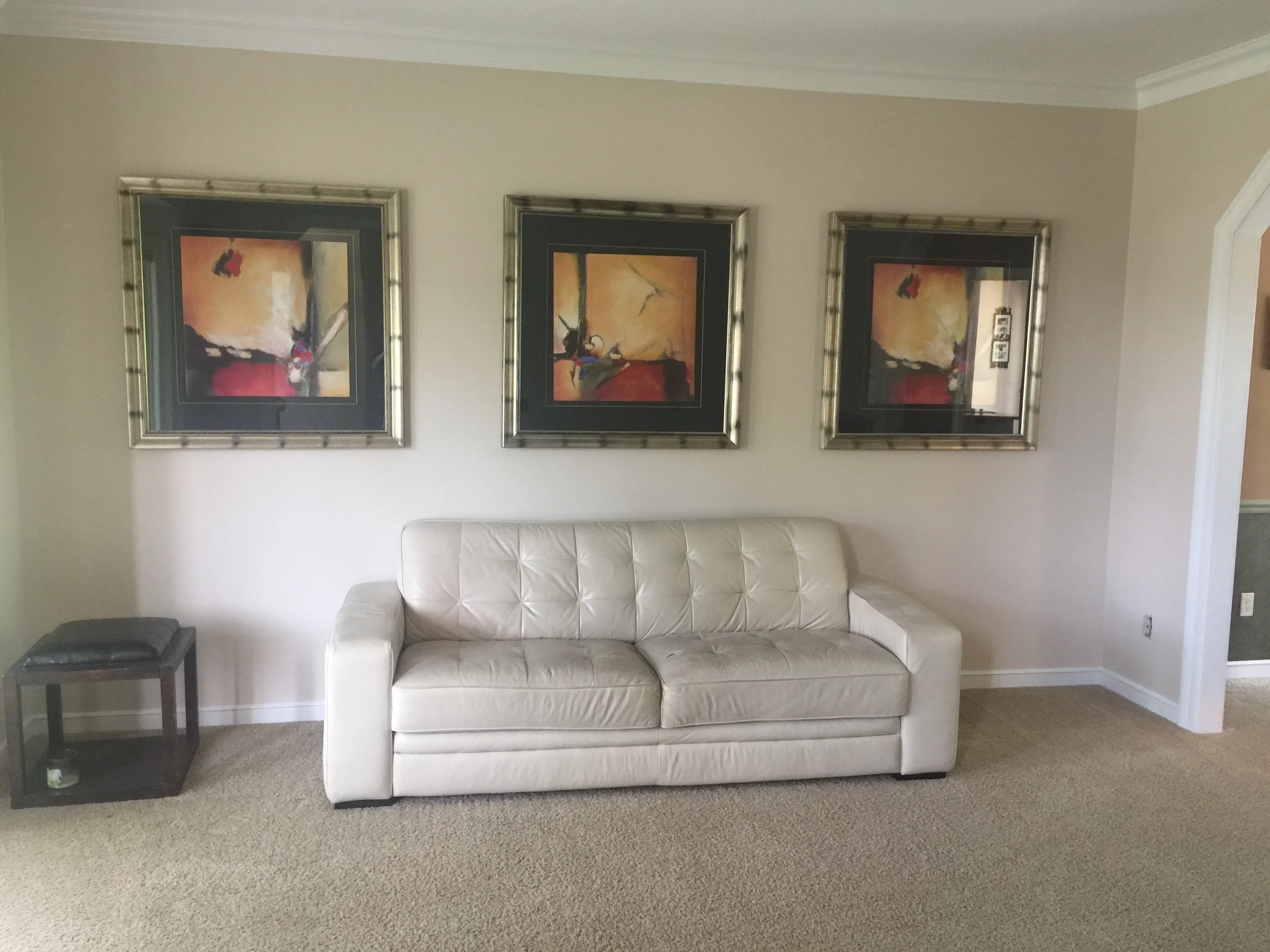 Beige painted walls with white trim and ceiling in living room space