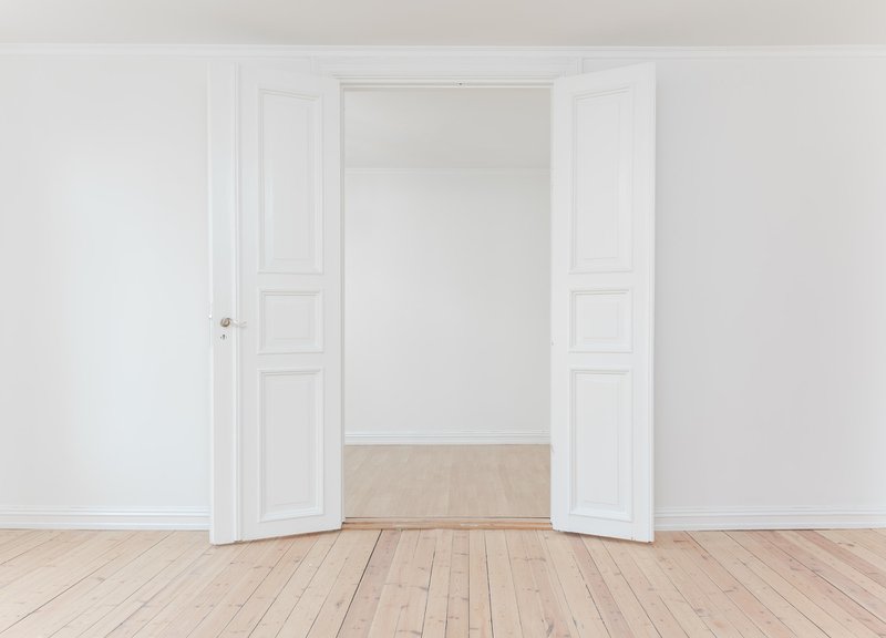 Door in a white room